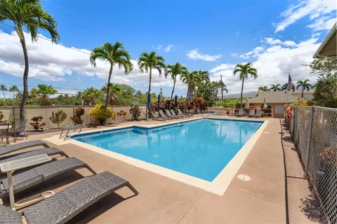 a view of a swimming pool with a lounge chair