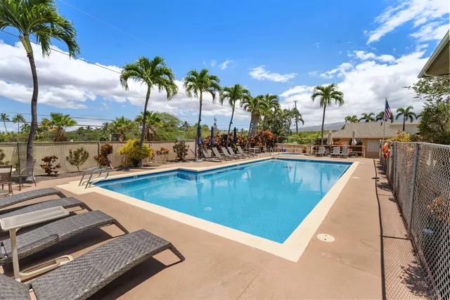 a view of a swimming pool with a lounge chair