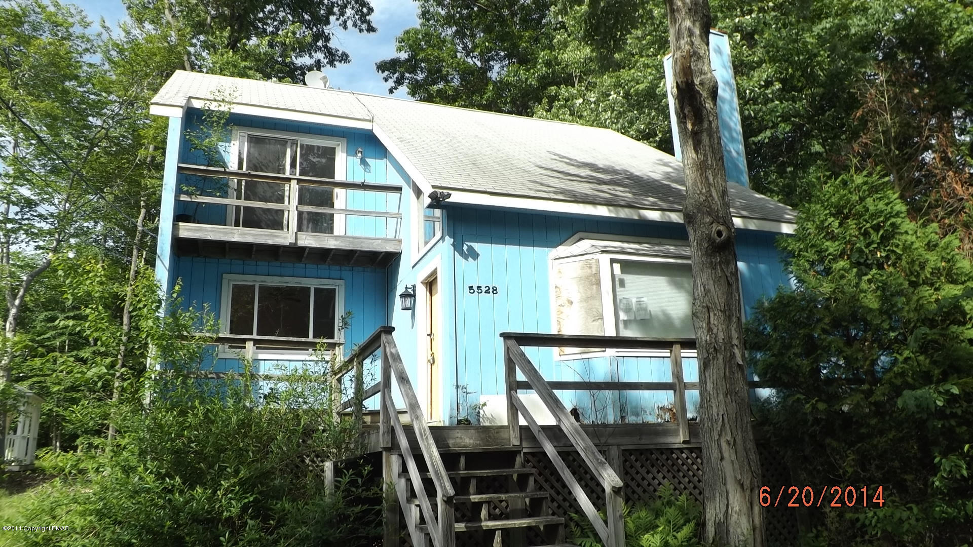 267 Coach Road Tobyhanna, PA 18466 - Photo 1 of 13 a house with trees in front of it