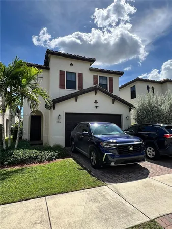 a car parked in front of a house