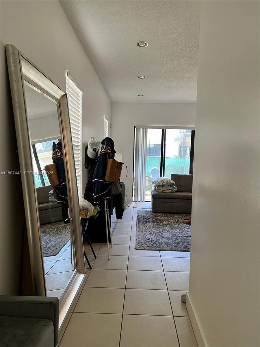 3214 West 97th Street Hialeah, FL 33018 - Photo 11 of 22 a living room with furniture and a rug