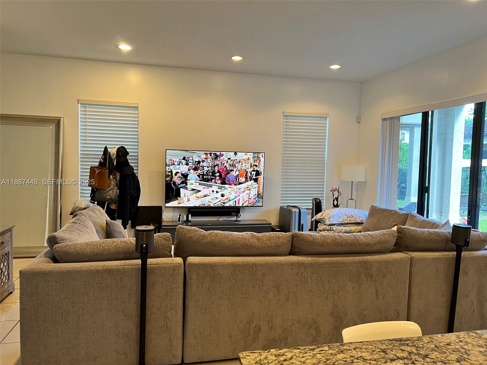 3214 West 97th Street Hialeah, FL 33018 - Photo 12 of 22 a living room with furniture and a flat screen tv