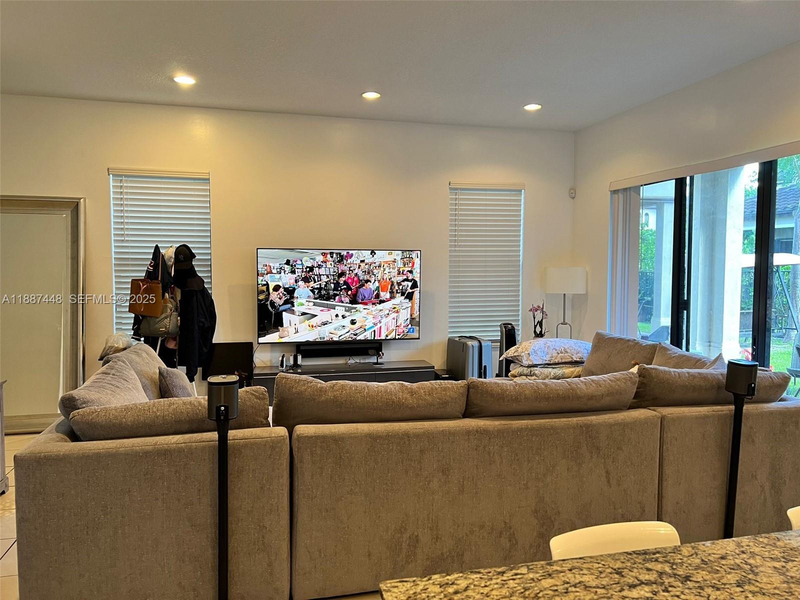 3214 West 97th Street Hialeah, FL 33018 - Photo 14 of 22 a living room with furniture and a flat screen tv