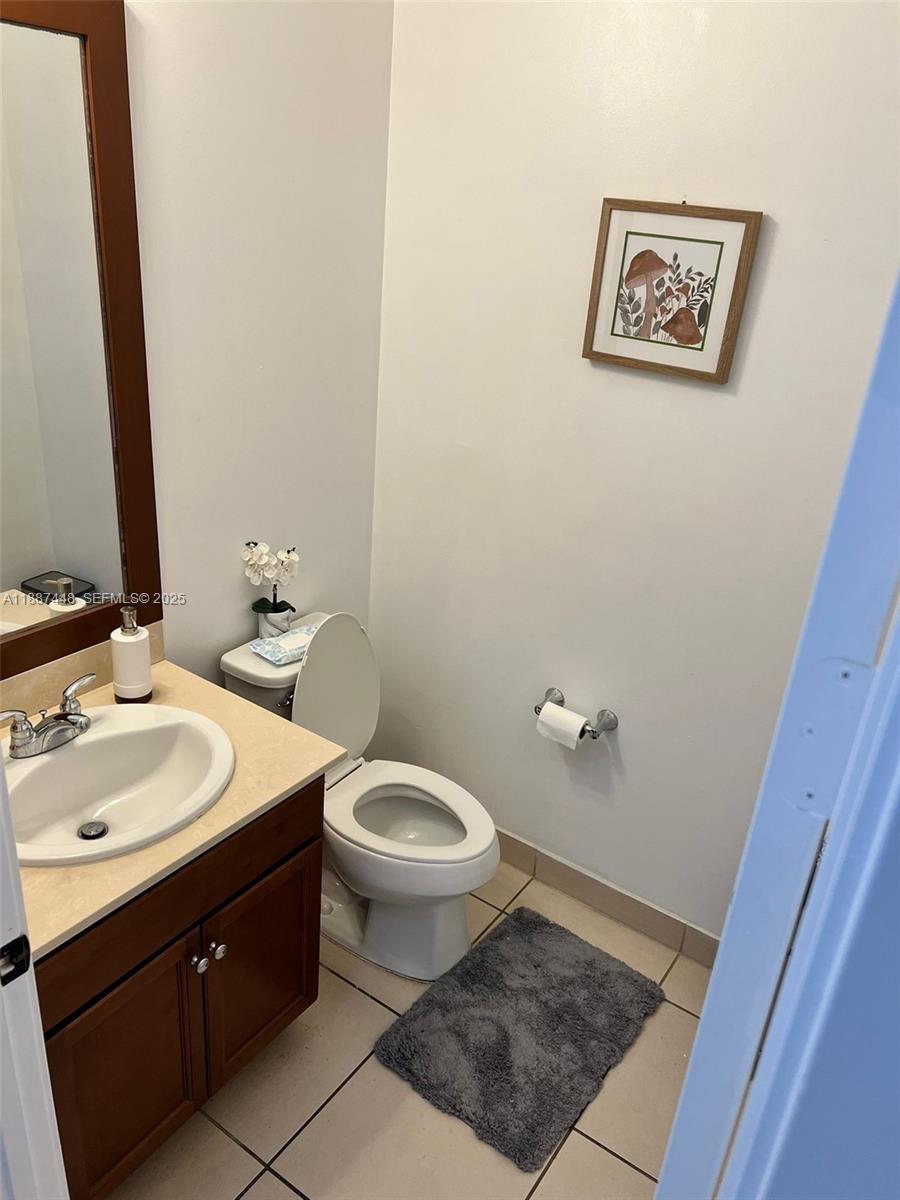 3214 West 97th Street Hialeah, FL 33018 - Photo 15 of 22 a bathroom with a sink and a toilet