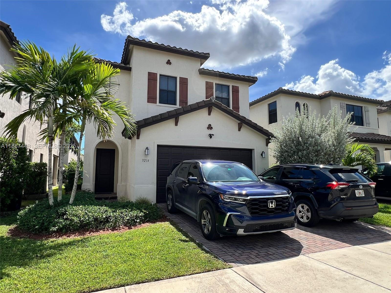 3214 West 97th Street Hialeah, FL 33018 - Photo 2 of 22 a view of a car parked in front of a house