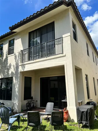 a front view of a house with patio