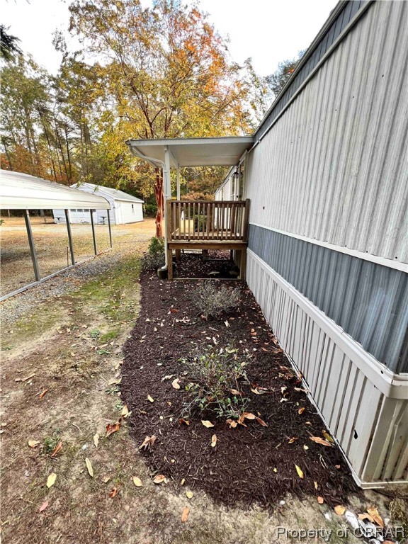 1295 Kates Neck Road Locust Hill, VA 23092 - Photo 10 of 24 View of yard with a wooden deck