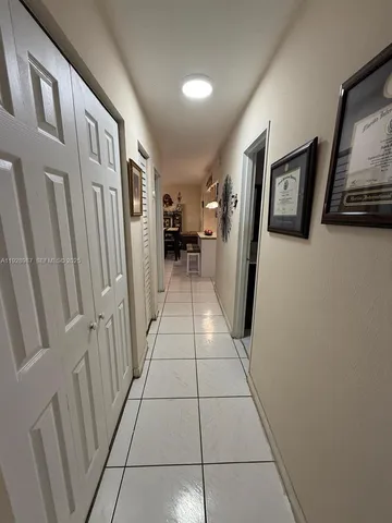 a bed room with a bed window and a flat screen tv