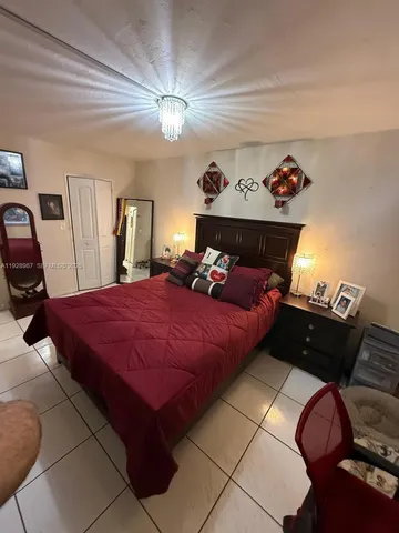 a view of walk in closet with clothes