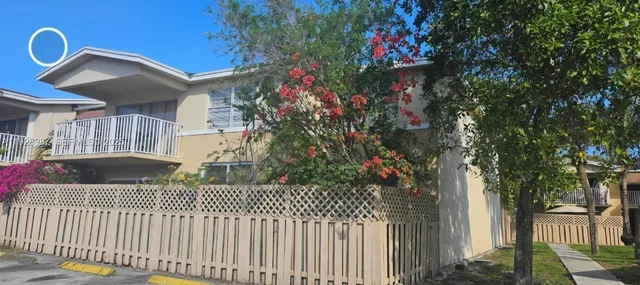 a house view with a garden space