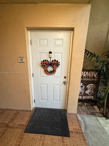 a dining room with furniture and a chandelier