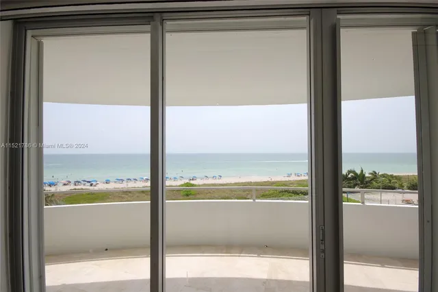 a front view of a house with a garden and swimming pool