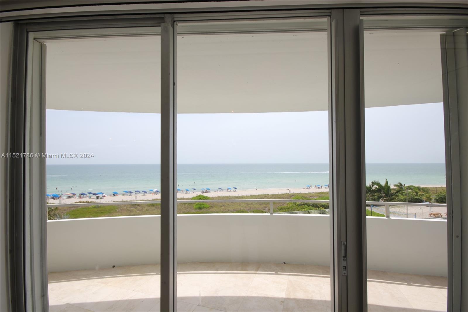 5151 Collins Avenue, Unit 532 Miami Beach, FL 33140 - Photo 30 of 62 a view of a glass door with a from window