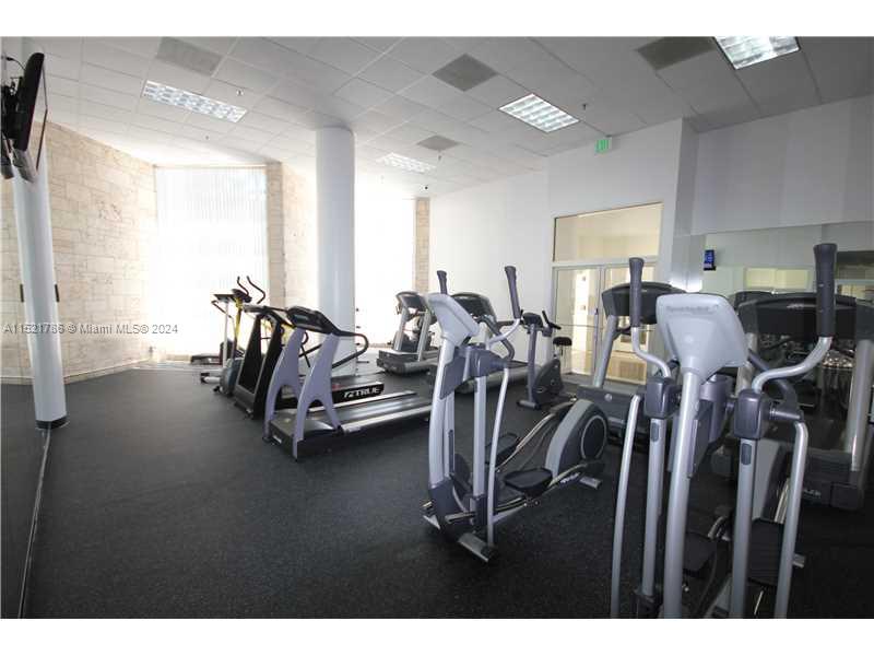 5151 Collins Avenue, Unit 532 Miami Beach, FL 33140 - Photo 49 of 62 a view of a room with gym equipment