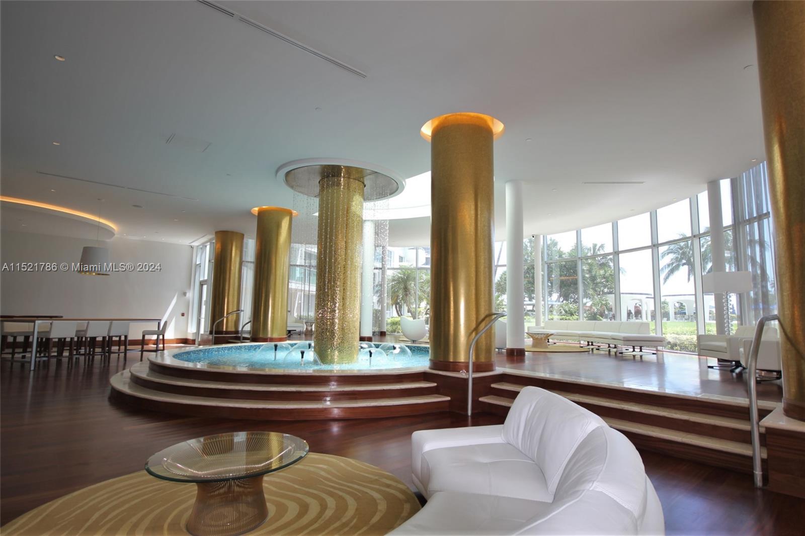 5151 Collins Avenue, Unit 532 Miami Beach, FL 33140 - Photo 50 of 62 a living room with furniture and a large window