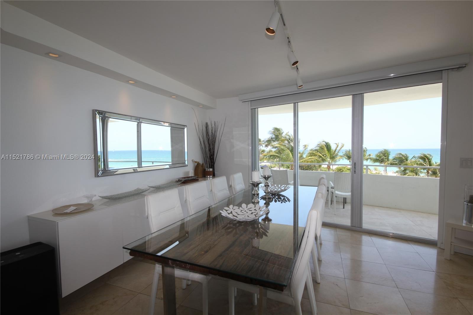 5151 Collins Avenue, Unit 532 Miami Beach, FL 33140 - Photo 60 of 62 a view of a dining room with furniture window and outside view