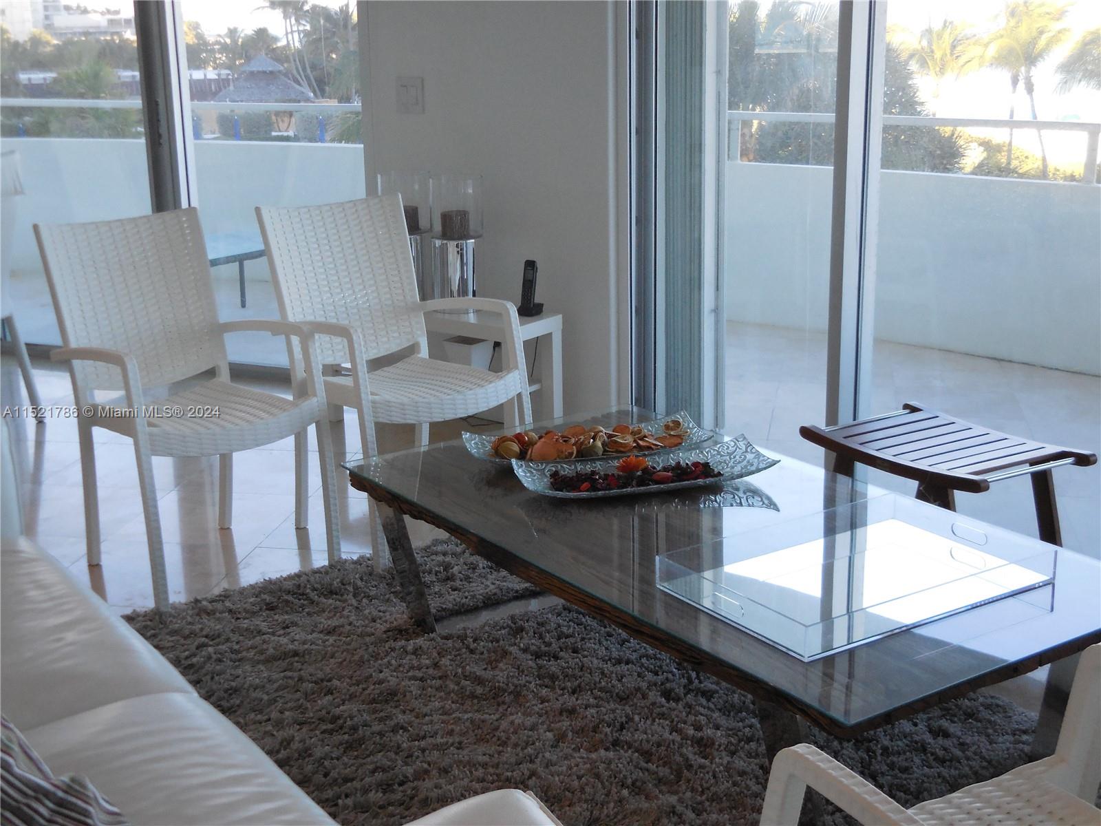 5151 Collins Avenue, Unit 532 Miami Beach, FL 33140 - Photo 8 of 62 a view of a dining room with furniture and a window