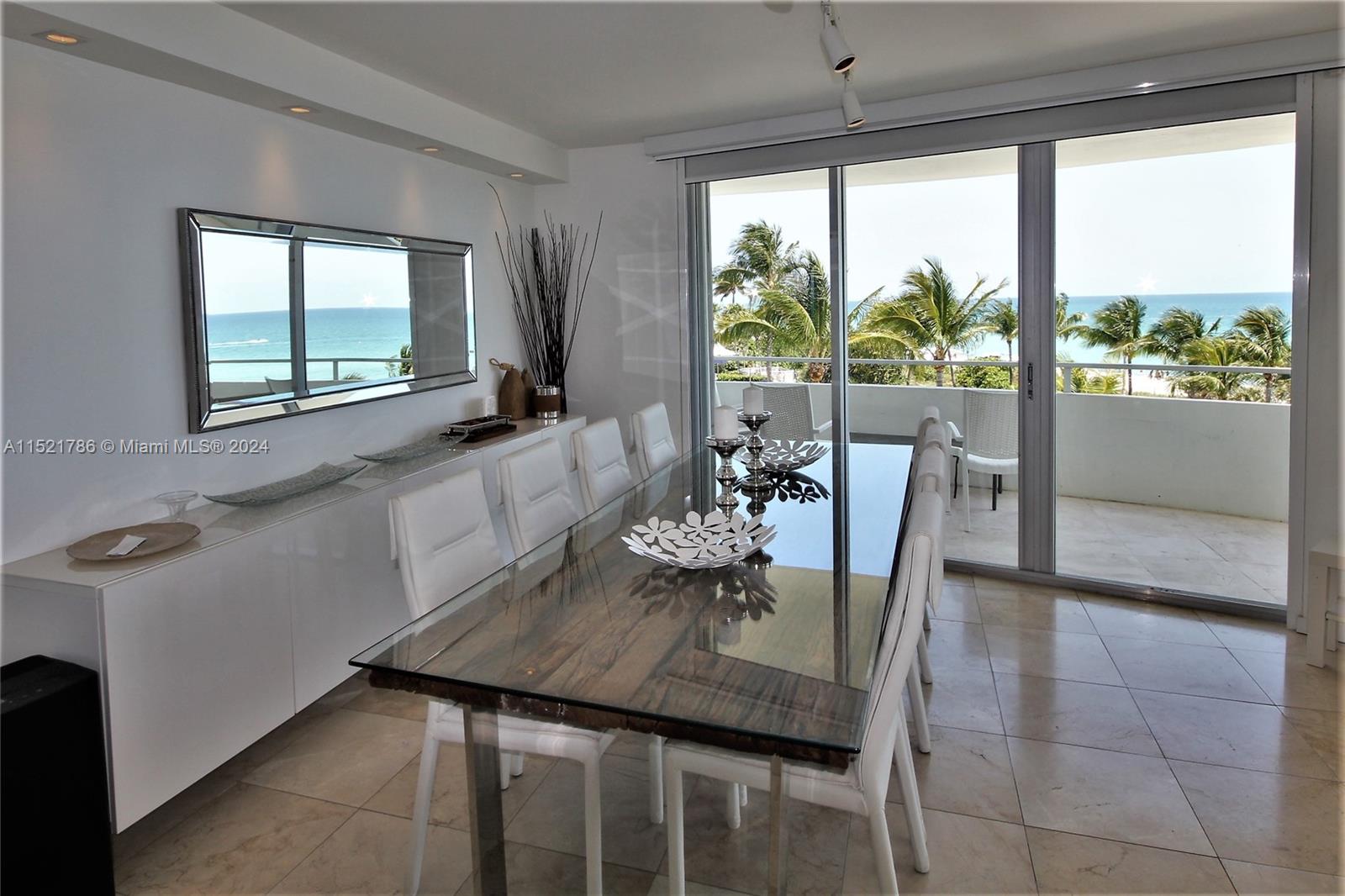 5151 Collins Avenue, Unit 532 Miami Beach, FL 33140 - Photo 9 of 62 a view of a dining room with furniture and a window