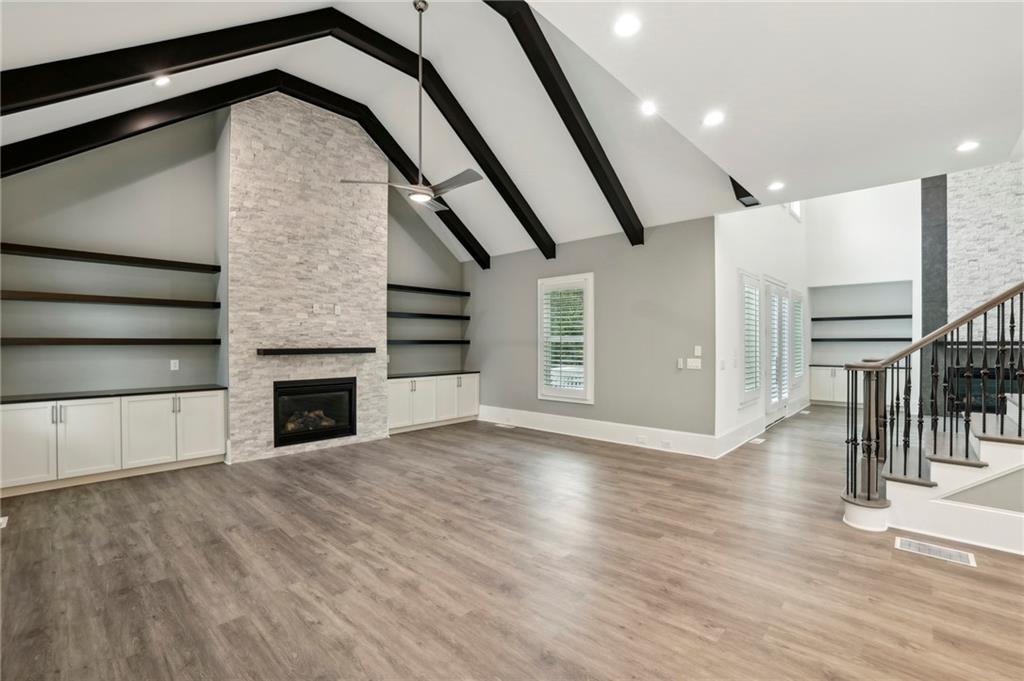 3750 Robinson Road Northeast Marietta, GA 30068 - Photo 16 of 57 a view of empty room with wooden floor and fireplace
