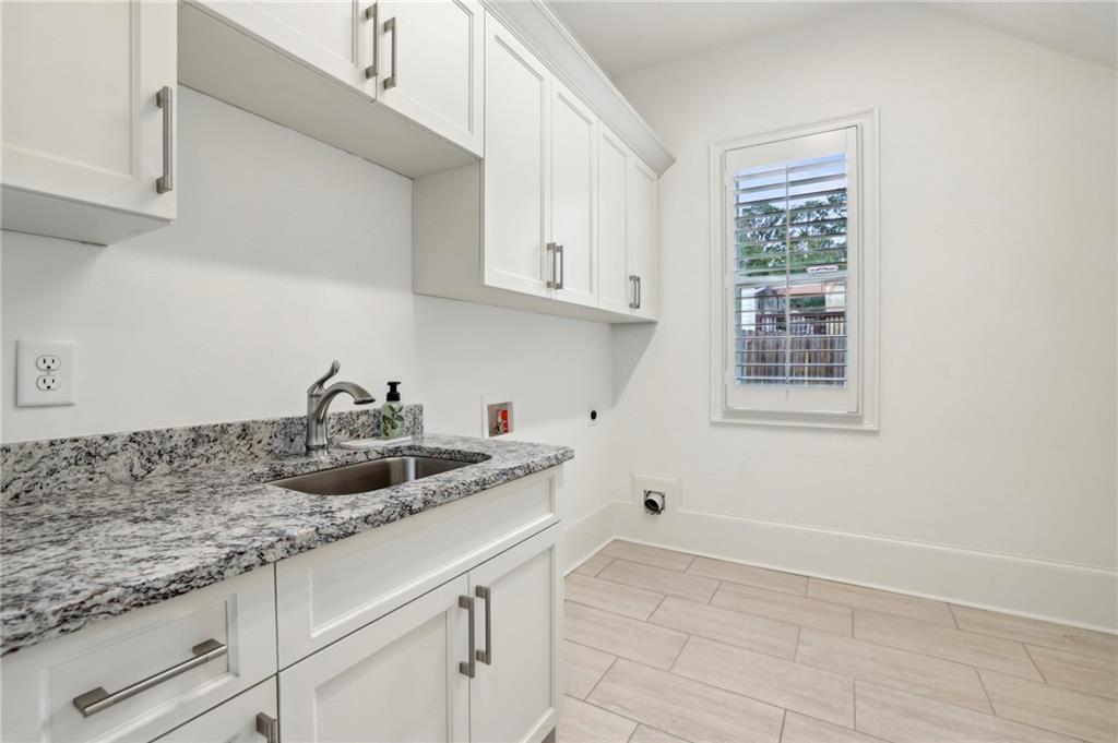 3750 Robinson Road Northeast Marietta, GA 30068 - Photo 28 of 57 a kitchen with granite countertop white cabinets and a window