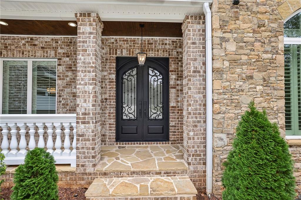 3750 Robinson Road Northeast Marietta, GA 30068 - Photo 3 of 57 a front view of a house with a garden