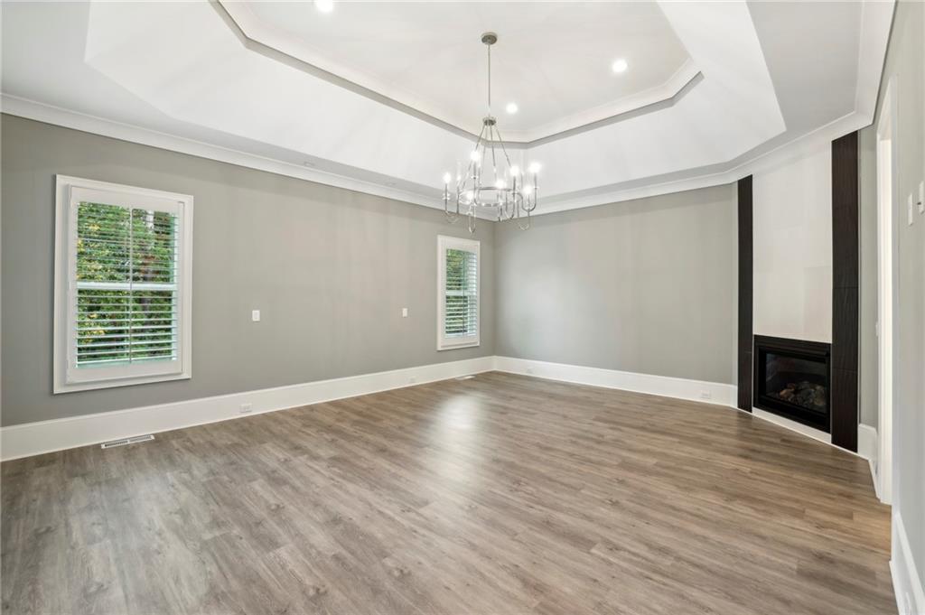 3750 Robinson Road Northeast Marietta, GA 30068 - Photo 31 of 57 a view of an empty room with wooden floor and a window