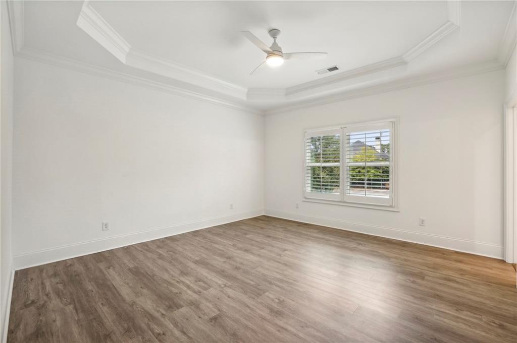 3750 Robinson Road Northeast Marietta, GA 30068 - Photo 40 of 57 an empty room with wooden floor and windows