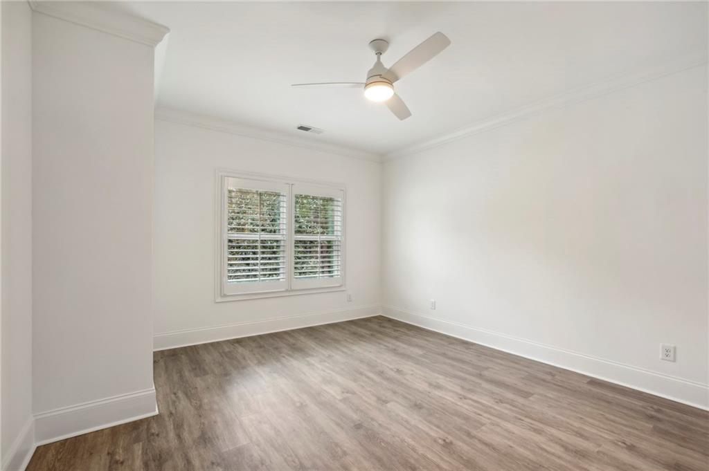 3750 Robinson Road Northeast Marietta, GA 30068 - Photo 42 of 57 an empty room with wooden floor and windows