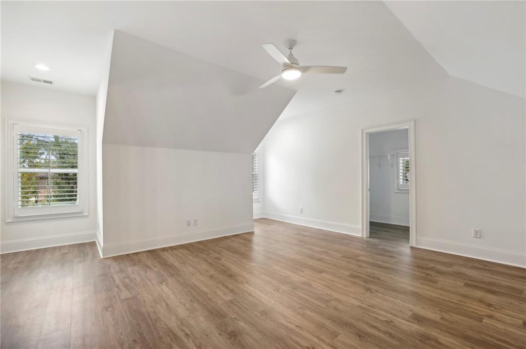 3750 Robinson Road Northeast Marietta, GA 30068 - Photo 44 of 57 an empty room with wooden floor and windows