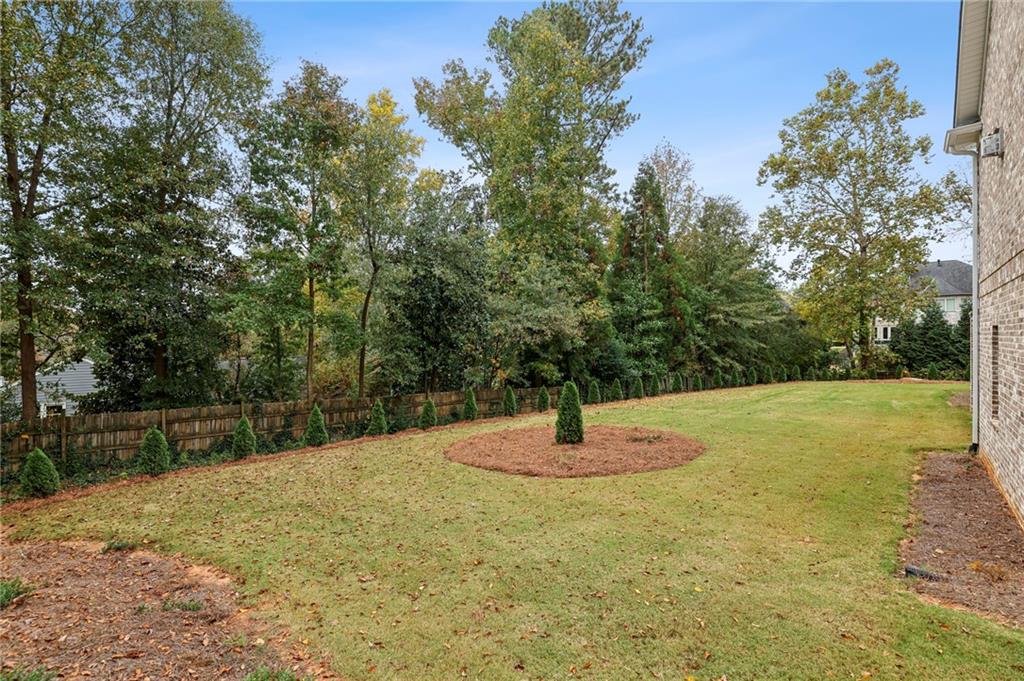3750 Robinson Road Northeast Marietta, GA 30068 - Photo 54 of 57 a swimming pool with some trees in the background