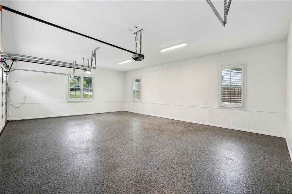 3750 Robinson Road Northeast Marietta, GA 30068 - Photo 55 of 57 an empty room with wooden floor and windows