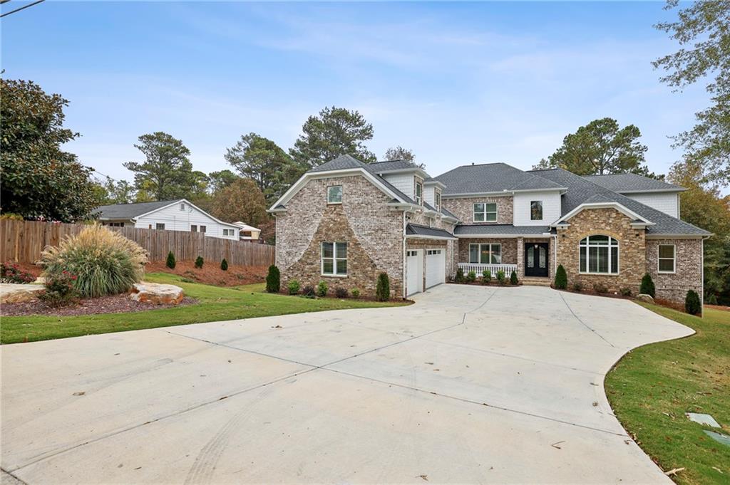 3750 Robinson Road Northeast Marietta, GA 30068 - Photo 57 of 57 a front view of a house with a yard and garage