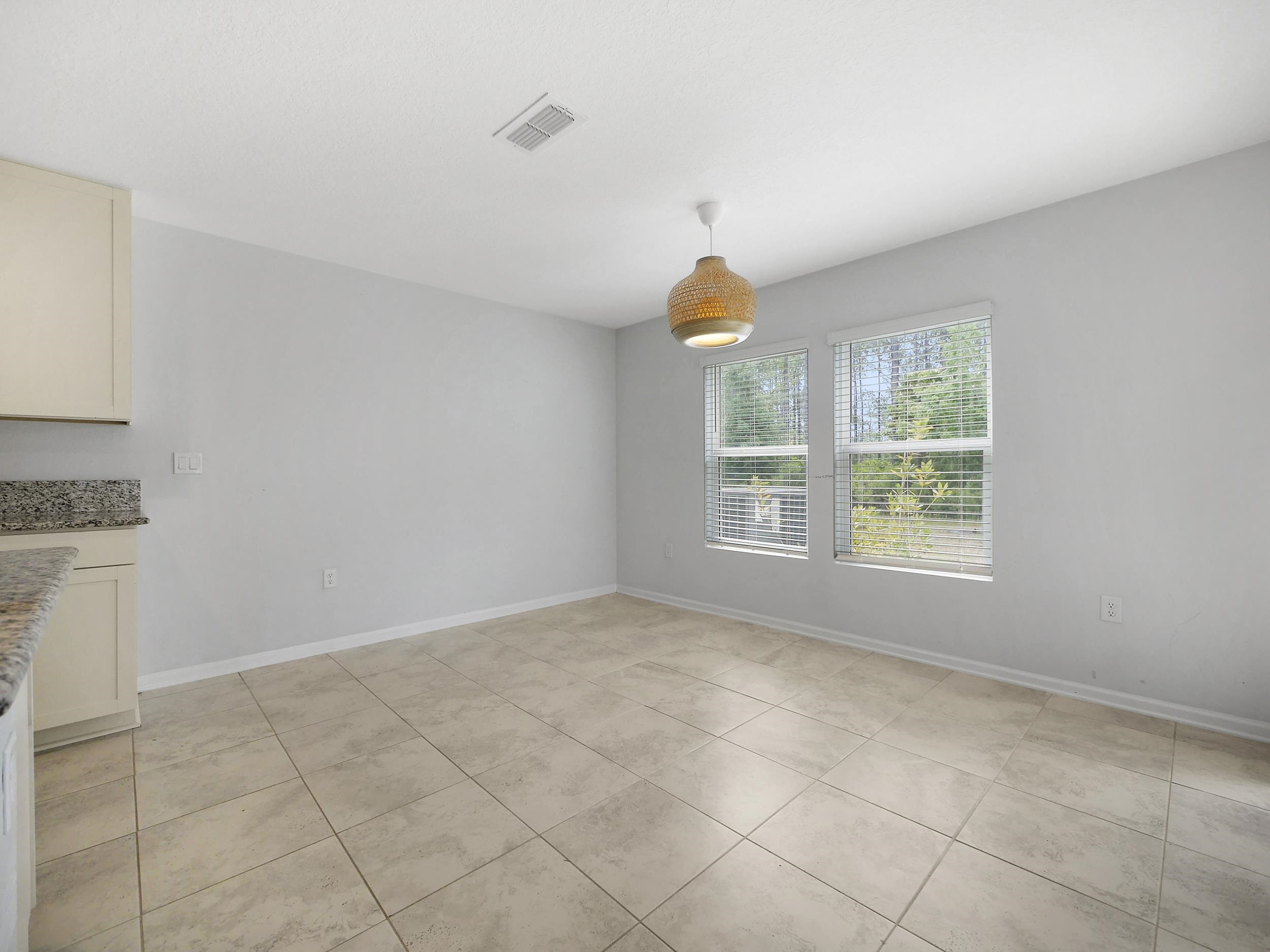 597 Meadow Ridge Drive St. Augustine, FL 32092 - Photo 19 of 56 a view of an empty room with a window