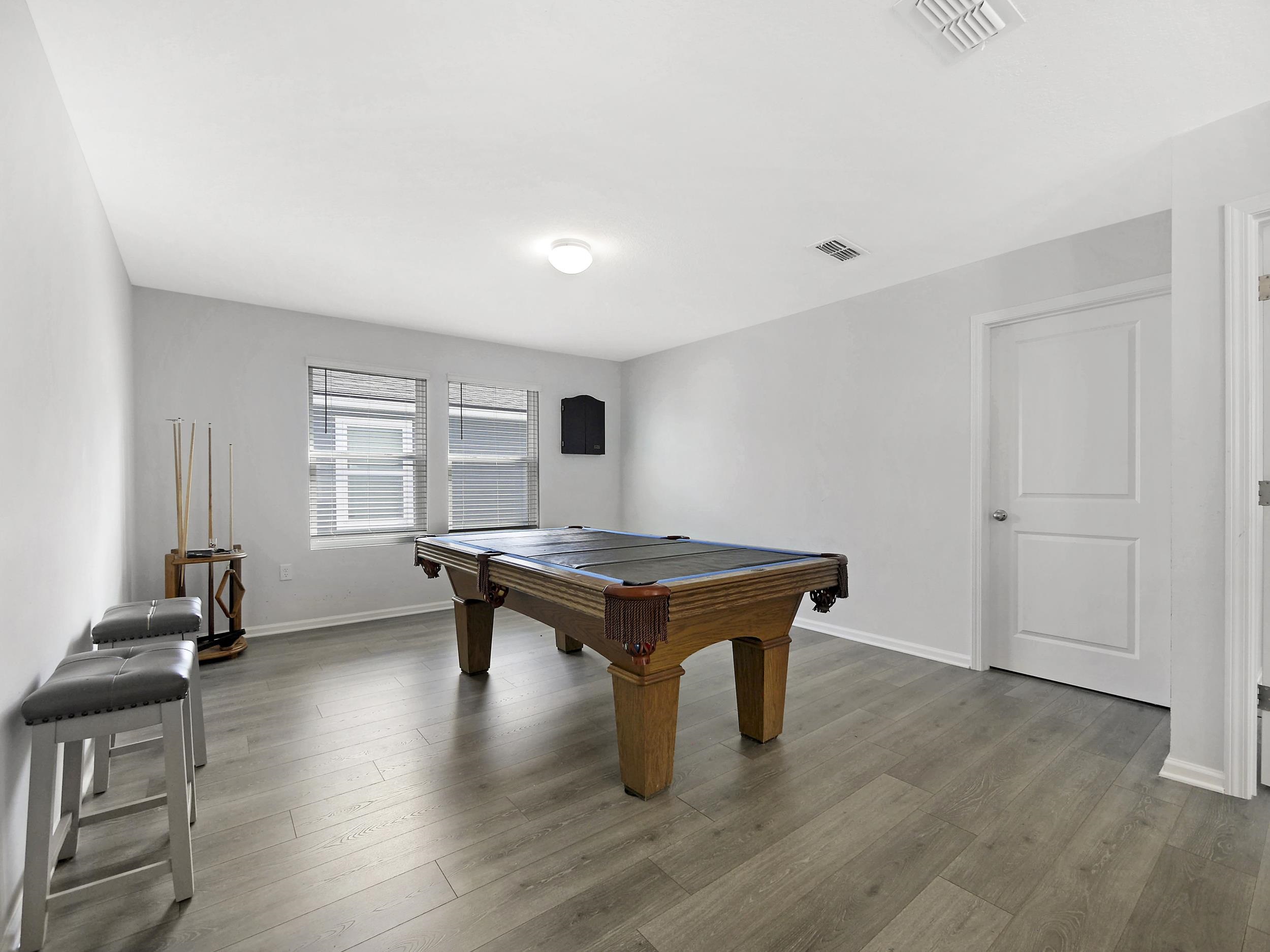 597 Meadow Ridge Drive St. Augustine, FL 32092 - Photo 32 of 56 a room with furniture pool table and windows