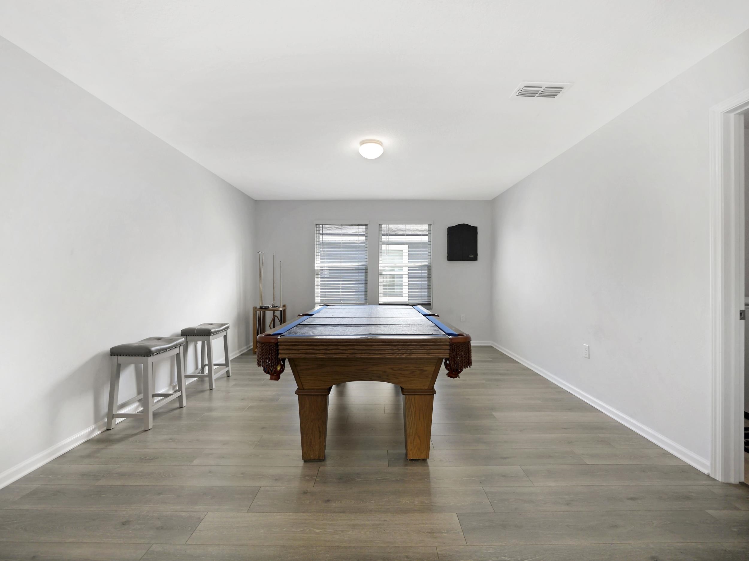 597 Meadow Ridge Drive St. Augustine, FL 32092 - Photo 33 of 56 a view of a room with a table and chairs