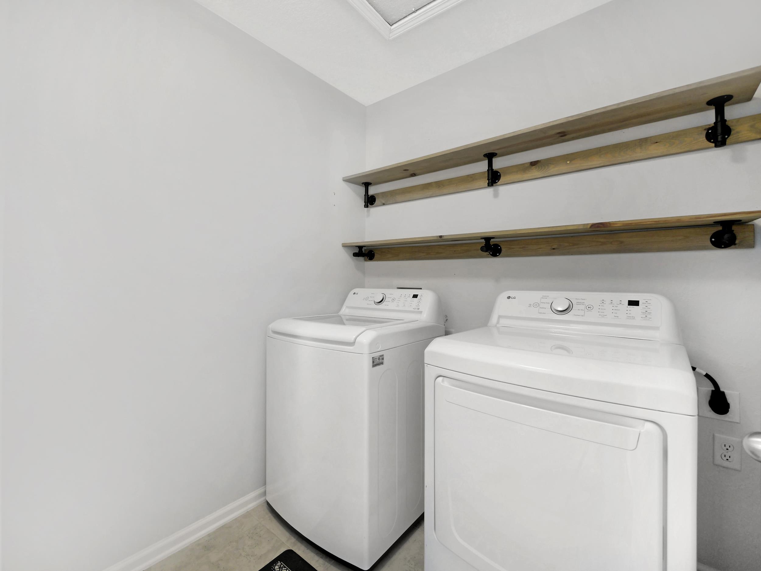 597 Meadow Ridge Drive St. Augustine, FL 32092 - Photo 36 of 56 a utility room with dryer and washer