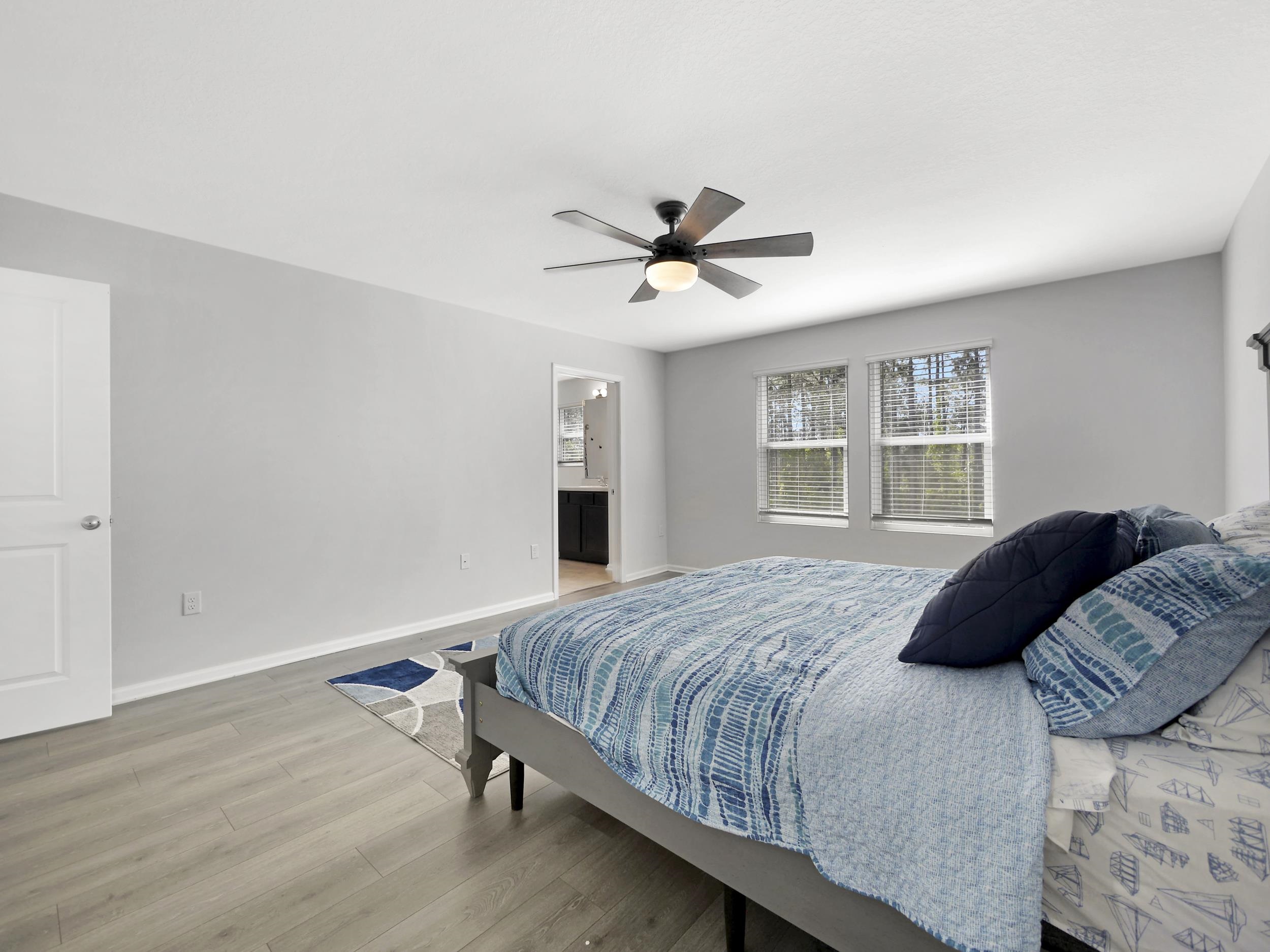 597 Meadow Ridge Drive St. Augustine, FL 32092 - Photo 38 of 56 a bedroom with a large bed and a window