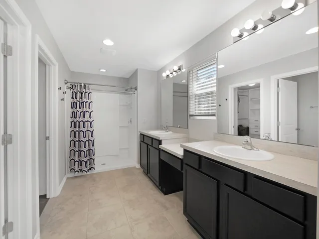 a view of a park and trees in the background