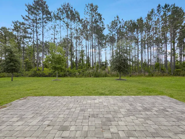 a front view of a house with garden and porch