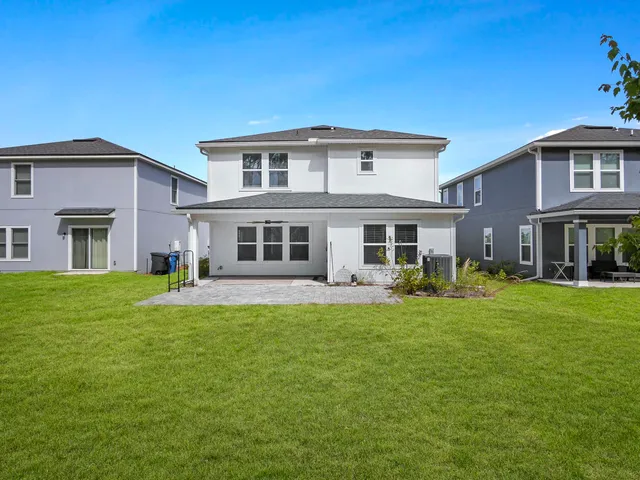 an aerial view of houses with yard