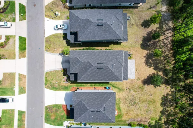 a view of a house with swimming pool and sitting area
