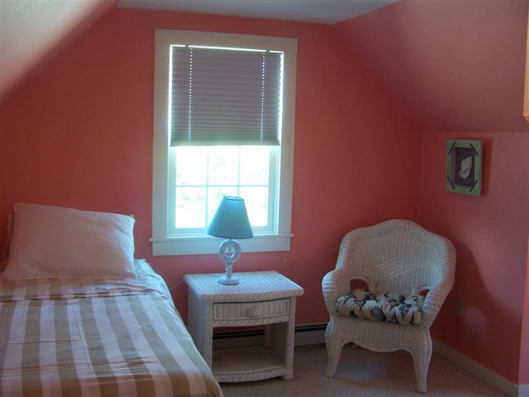69 Rock Harbor Road Orleans, MA 02653 - Photo 27 of 29 a bedroom with a bed and a window
