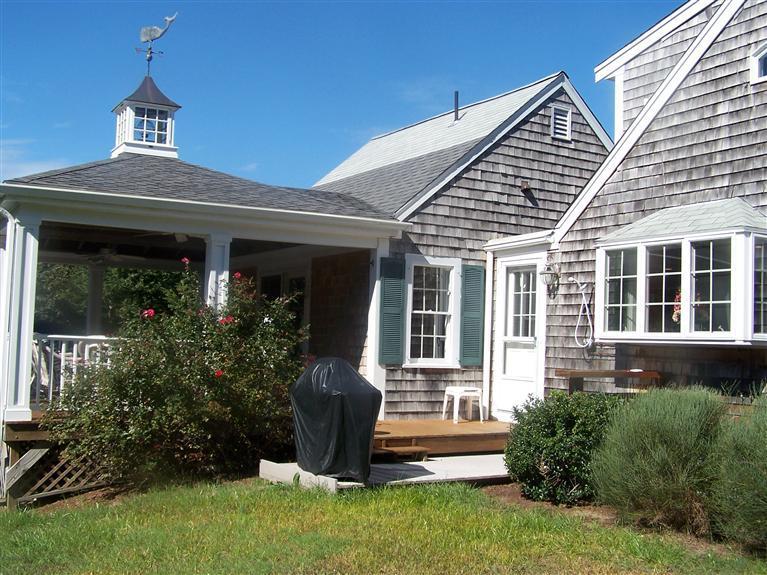 69 Rock Harbor Road Orleans, MA 02653 - Photo 3 of 29 front view of a house with a yard