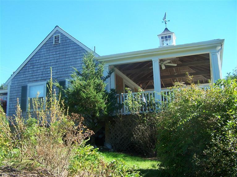 69 Rock Harbor Road Orleans, MA 02653 - Photo 8 of 29 a front view of a house with a yard