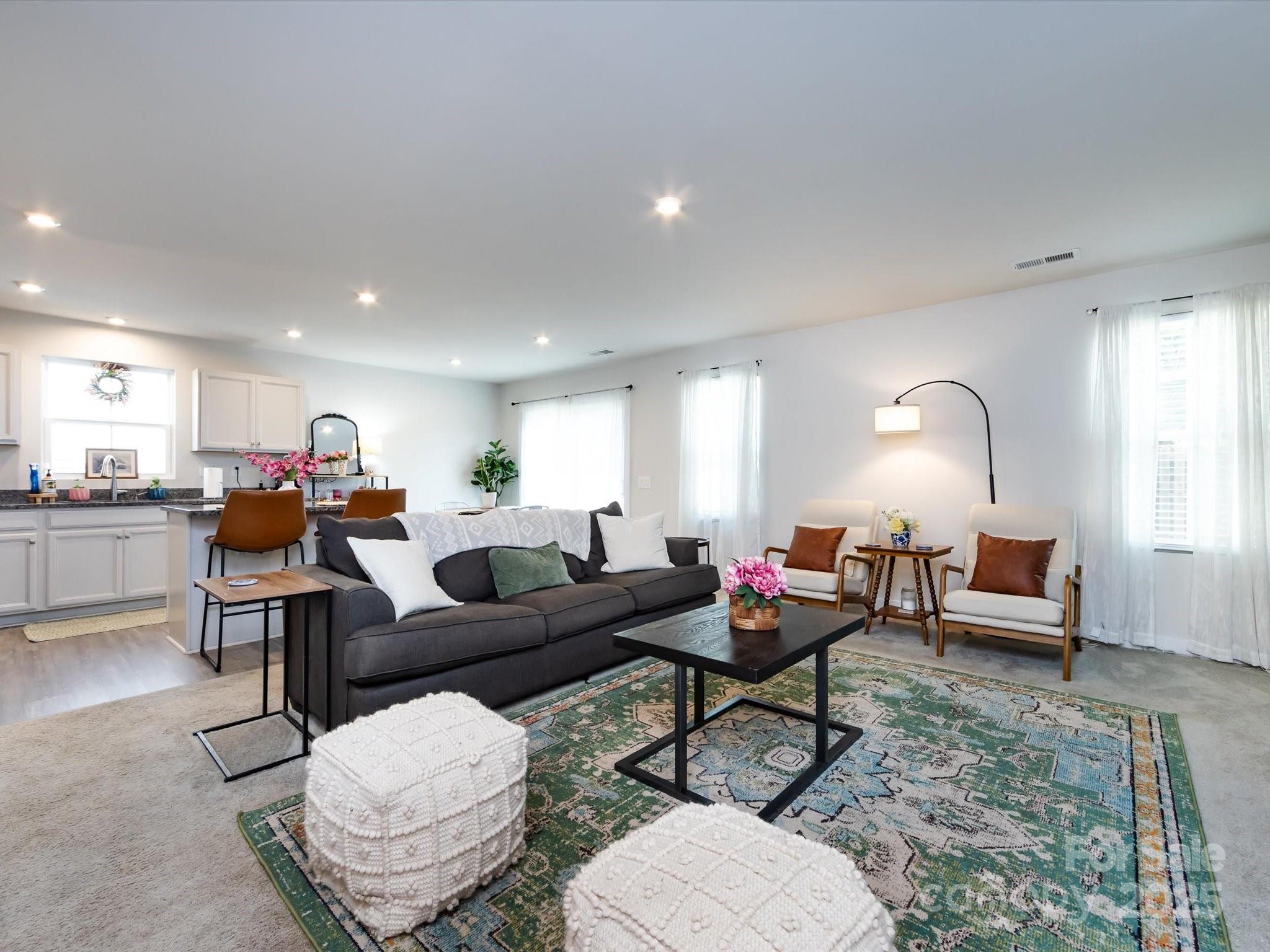 4231 Mackinnon Drive Charlotte, NC 28214 - Photo 11 of 35 a living room with furniture kitchen and a table