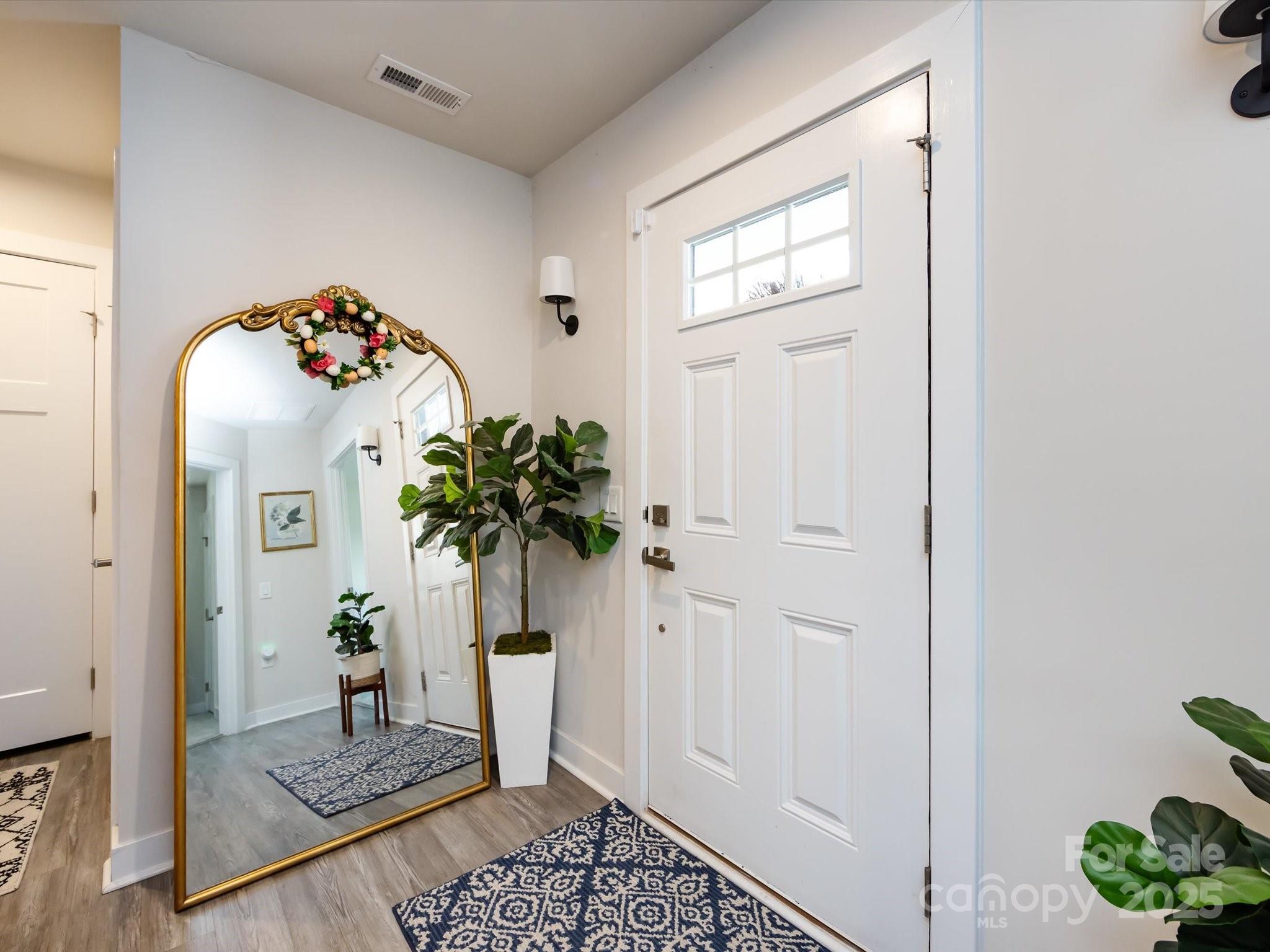 4231 Mackinnon Drive Charlotte, NC 28214 - Photo 5 of 35 a vase of flowers sitting on a floor