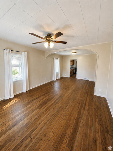 1766 Kenilworth Road Spring Glen, UT 84526 - Photo 6 of 24 Spacious room featuring wood-finish flooring, a ceiling fan with integrated lighting, and multiple windows with blinds