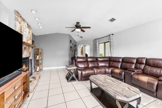 a kitchen with stainless steel appliances a stove a sink a refrigerator and cabinets