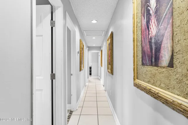 a bathroom with a granite countertop sink a toilet a mirror and shower