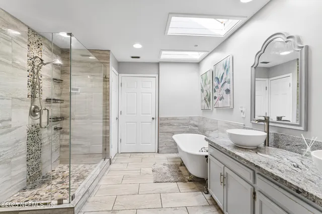 a view of a livingroom with workspace and a window